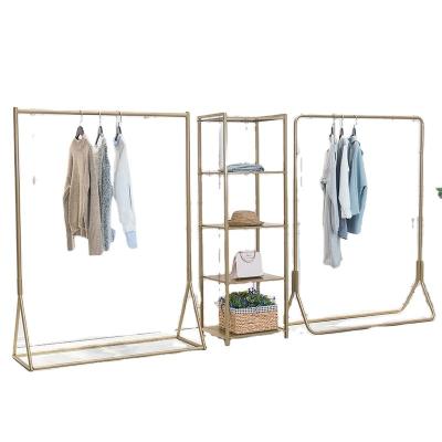 China Competitive price minimalist heaven and earth gold makeup display stand rack for clothes hats gold shoes and bags for sale