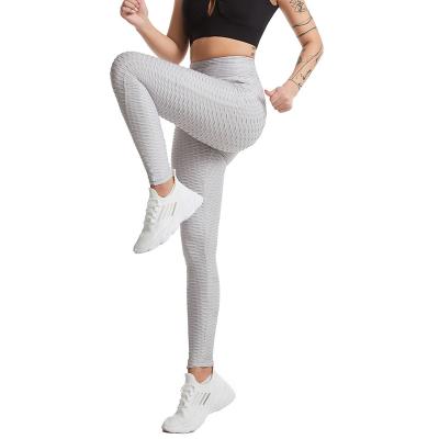 China Factory Supply Breathable Wear Sporty Hip Lifting High Waist Jacquard Yoga Pants For Women With Pocket for sale