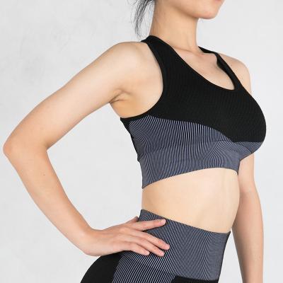 China Skin Friendly Breathable X Back Sports Seamless Gym Push Up Fitness Women's Sports Bra Yoga for sale