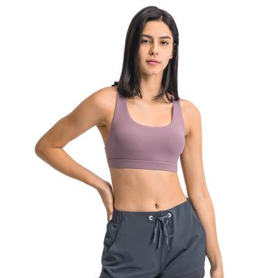 China Low Price Breathable Seamless Lightweight Quick Dry Adjustable Buckle Spandex Cross Ladies Sports Shockproof Bra for sale