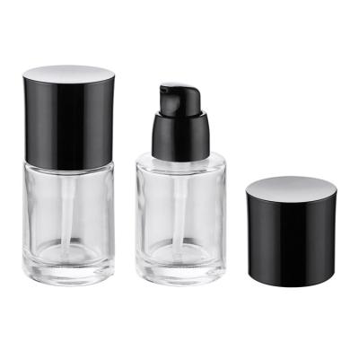 China Popular Non Puddle Design Round Shape Serum Bottle 30ml Serum Glass Bottle Pump for sale