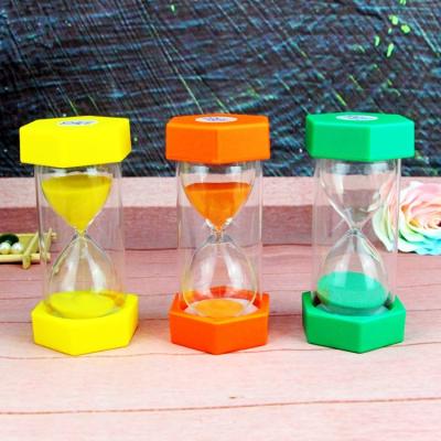 China Educational Hexagonal Plastic and Palying Educational Toys Teacher The Clock Ten Minute Glass Sand Timer Hourglass Colored Sand for Gifts for sale