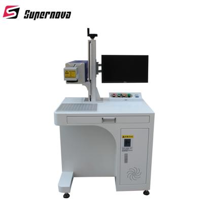 China máquina ULTRAVIOLETA plástica de la marca del laser de 3W 5W con recinto protector en venta