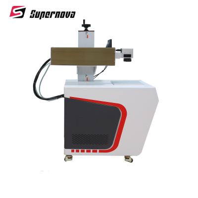 China Máquina ULTRAVIOLETA de la marca del laser de 3W del casquillo de la botella del grabador ULTRAVIOLETA plástico del laser en venta