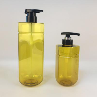 China Customized Cosmetics Empty 500ml 1000ml 17oz PET Transparent Amber Hexagon Luxury Pump Shapmoo Bottle for sale