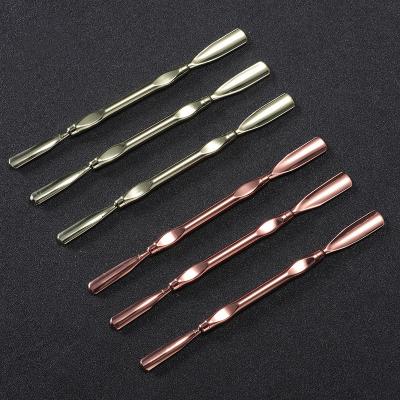 China Easy Apply Professional Rose Gold Double Heads Stainless Steel Cuticle Push Dead Skin Remover Er for sale