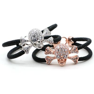 China FASHIONABLE Skull S925 Pure High Quality Sterling Silver Crossbones Charm Diamonds Two Stingray Python Strings Hand-wrapped Leather Bracelet for sale