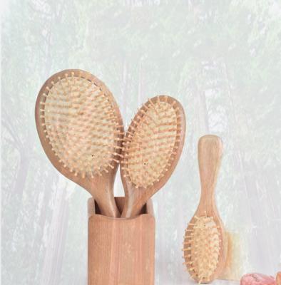 China Customized Large Paddle Set Eco-friendly Biodegradable Medium Small Waterproof Beech Airbag Massage Hair Comb Natural Wood Brush for sale