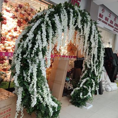 China Selling metal frame+artificial flowers wisteria green along hot circle shape leaves artificial flower panel wedding arch metal stand for wedding decoration for sale