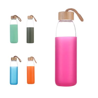 China Art Decor Wholesale 550ml Silicone Sleeve Borosilicate Glass Water Bottle With Bamboo Lid for sale