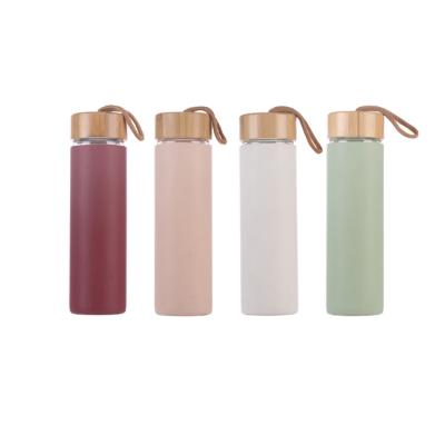 China Art Decor Borosilicate Glass DRINKING Water Bottle with Silicone Sleeve for sale