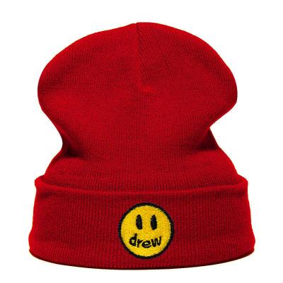 China COMMON hot selling men and women smiley faces embroidered warm knitted beanie woolen winter hat for sale