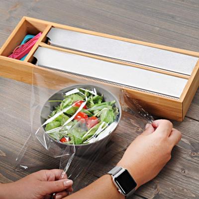 China Sustainable Kitchen Plastic Cling Film Wrap Wall Mount Holder Dispenser Aluminum Aluminum Bamboo Dispenser With Cutter for sale