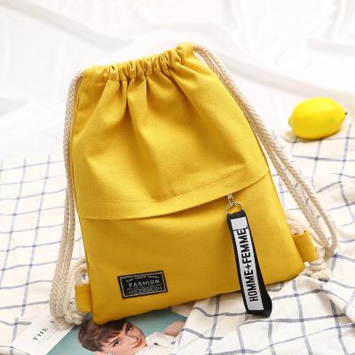 China Custom No Logo Fashionable Canvas Cotton Drawstring Backpack Bag With Exterior Zipper Pocket for sale