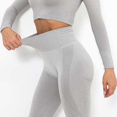 China Seamless high waisted set of workout leggings crack! crack! Compression Wear Butt Breathable Yoga Sports Sets for sale