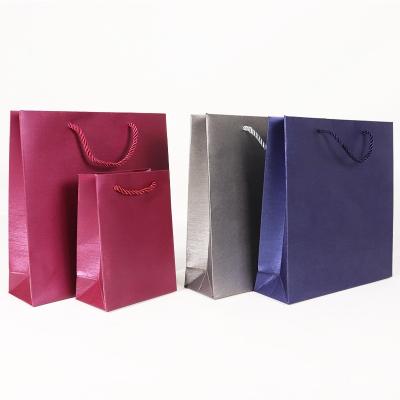 China Recyclable Top custom foil logo green shopping bag paper boutique grosgrain ribbon gift luxury jewelry paper bag for sale