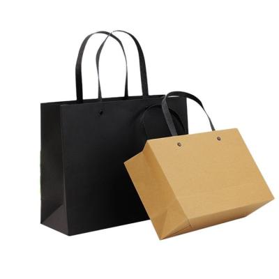 China Recyclable luxury New Gold Logo Hot Foiled Stamping Black Matt Kraft Paper Bag With Cotton Rope Handles for sale