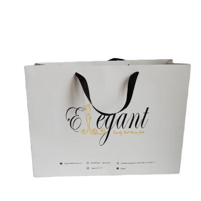 China Recyclable Wholesale luxury Logo Printed Luxury Kraft Retail Paper tote bag Shopping Bag Paper Gift Bag With Handle and ribbon Close for sale