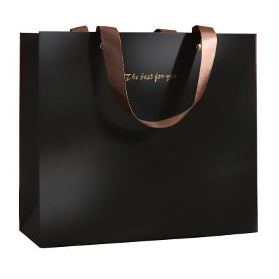 China Recyclable Custom Branded Logo Luxury  Paper Clothing Packaging Gift Shopping Bag Paperbag With Ribbon Handle for sale