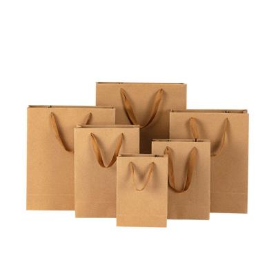 China Recyclable Custom quality  luxury black white brown kraft Gift Shopping Paper Bags with your own logo for sale