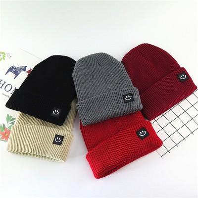 China COMMON Smile Face Fashion Cotton Cartoon Pattern Adjustable Winter Keep Warm Beanie Knitted Hat for sale