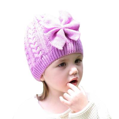 China Character Autumn Winter Nnew Fashion Brand Kids Solid Color Dome Outdoor Warm Bowknot Knitted Hat for sale