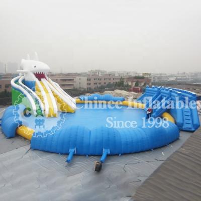 China 0.6mm Plato PVC Tarpaulin Canton Giant Commercial Inflatable Water Park Slide With Pool for sale