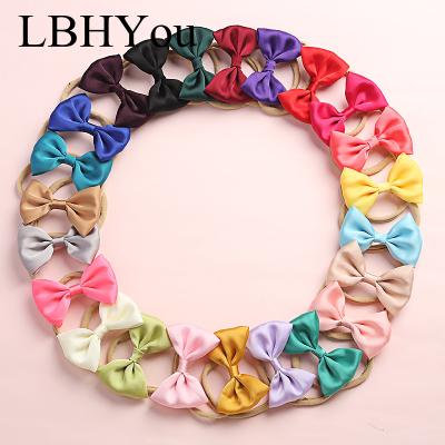 China Newest Designed Elastic Summer Hand Silk Tie Bows Nylon Headbands For Girls Fashion To Newborn Babies Super Soft Nylon Headbands for sale