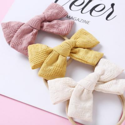 China 2021spring babies cotton hair clips fancy fashion bel nylon headband baby hair accessories colorful cotton soft bow canvas headband for sale