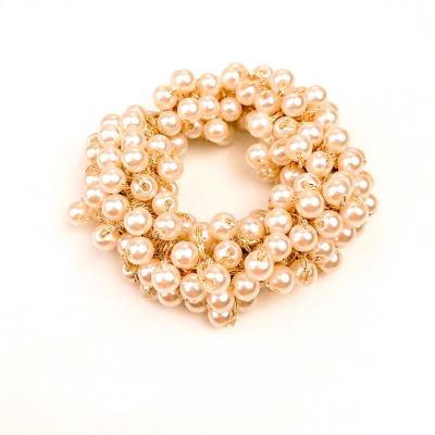 China Wholesale Elastic Crystal Designer Pearl Hairband Girls Hair Decoration Pearl Headband Elastic Hair Ties For Women Bracelet Pearl Hair Tie for sale