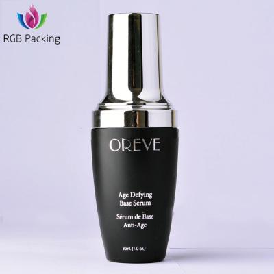 China Personal Care 30Ml Matte Black Coated Cosmetic Glass Lotion Bottle With Silver Cap And Logo Printing for sale