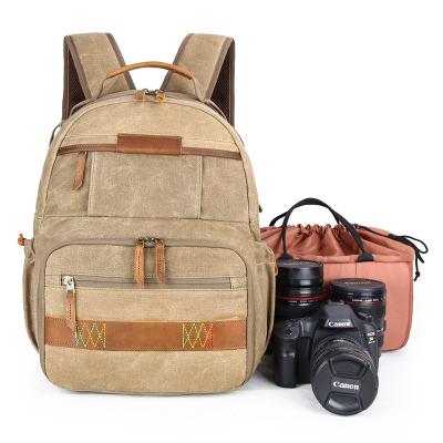 China Multifunctional Lightweight Waterproof SLR Accessories Tripod Photography Backpack Vintage Canvas Camera Backpack Camera Bag for sale