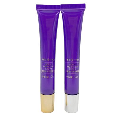 China Small Cosmetic Luxury Custom Plastic Purple 20g Squeeze Tubes Eye Massage Cream Tube With Roll Head Gold Screw Lid For Cosmetic Packaging for sale