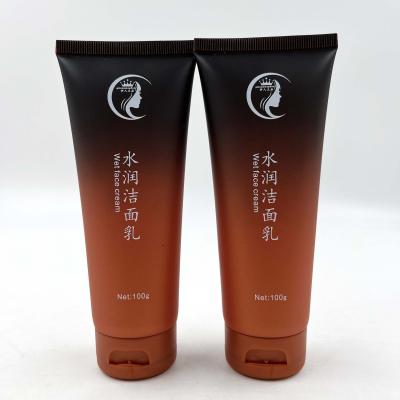 China Cosmetic Luxury Custom Orange 100g Plastic Squeeze Black Gradient Empty Tubes Face Detergent Tubes With Flip Cover For Cosmetic Packaging for sale