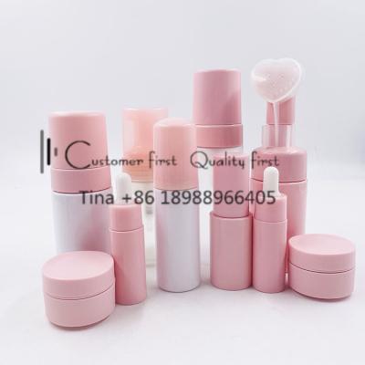 China Plastic Cosmetics Containers Pink Cosmetics Bottle Jars For Skincare Custom Packaging Set for sale