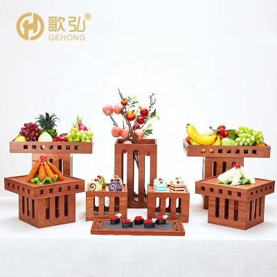 China Durable and modern five-star luxury wooden altitude square tableware dessert cake hotel buffet stand wooden rack for sale