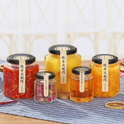 China Freshness Preservation China Suppliers Canning With Gold Safety Button Lid Glass Jar 45ml-730ml Hexagon Jars Glass Bottle for sale