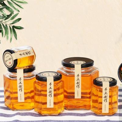 China Freshness Preservation 13oz 16oz 24oz Large Hexagon Glass Storage Jar For Honey With Screw Cap Lid for sale