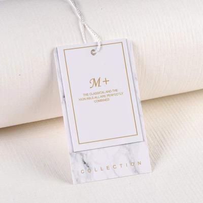 China New Fashion Sustainable Design Recycled Label Embossed Hang Tag Special Gift String Paper Hang Tags For Apparel Own Logo for sale