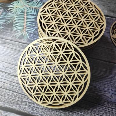 China Round Table Coasters Europe Crafts Supplier White Round Wooden Hollow Pattern Restaurant Decoration Coasters for sale