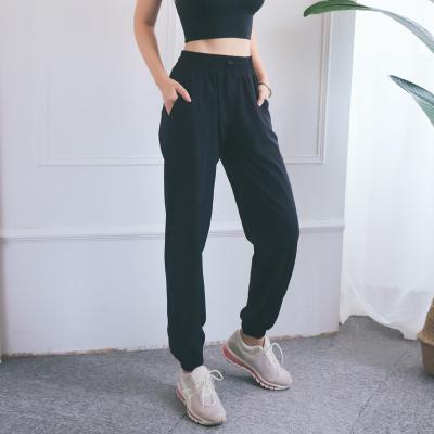 China 2021 Anti-Wrinkle Drawstring High Waist Workout Clothes Peach Hips Loose Feet Elastic Sports Ladies Joggers Pants Womens Pants for sale