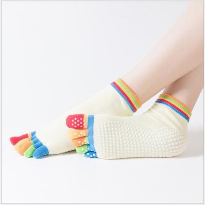 China Quality Graphic Women's Socks Five Finger Toe Middle Tube Monochrome Pvc Yoga Non-slip Open Antibacterial Sports Socks for sale