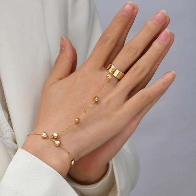 China TRENDY Simple Heart Pendant Chain Bracelet Link Connected Gold plated Wide Finger Ring Bracelets for Women Link Hand Harness Jewelry for sale