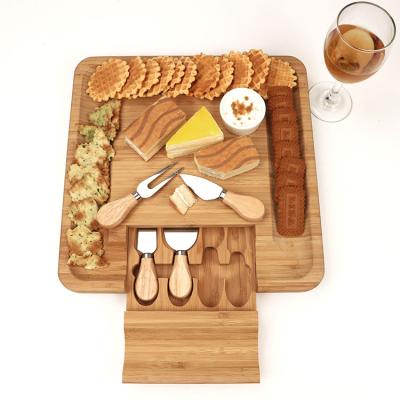 China Sustainable Bamboo Cutting Board Set With 5 Pcs Stainless Steel Cheese Knife Bamboo Cheese Board for sale