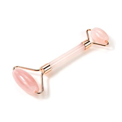 China Beauty Rose Quartz Crystal Polished Natural Stone Healring Anti Aging Roller for Slim Face for sale