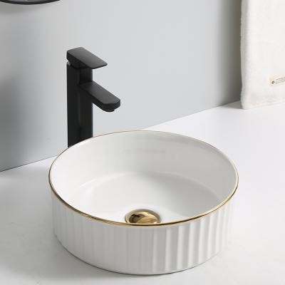 China Craftsman Luxury Modern CE CUPC Plated Handmade Ceramic Round Basins Bathroom Sink Art Basin For Hotel With Gold Edge for sale