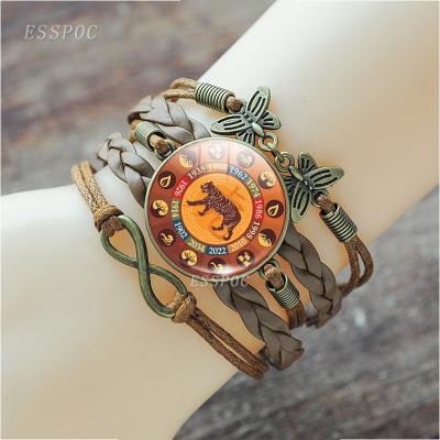 China Fashion 12 Vintage Animal Vintage Zodiac Bracelet Brown Woven Bracelet 25mm Dome Jewelry Gift Leather Woven Men and Women's Bracelets for sale