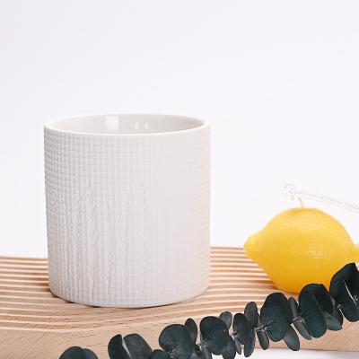 China Wholesale Modern Simple Embossed Cup Candle Holder Modern Candle Jar Ornaments Ceramic Soy Wax Container Household Aroma Candle Jar for sale