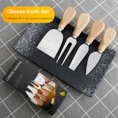 China Viable Creative Kitchen Knife 4 Pieces Stainless Steel Cheese Butter Slicer Serving Knives Set With Wooden Handles for sale