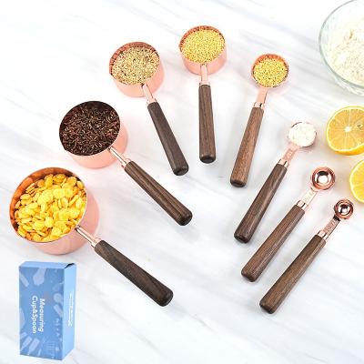 China Viable Kitchen Tools Vintage Walnut Baking Measuring Wood Handle 8pcs 304 Stainless Steel Rose Gold Measuring Cups Spoons Set for sale